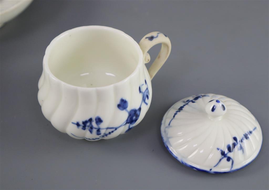 A St. Cloud cup and trembleuse saucer, c.1725-1740 and a Chantilly custard cup and cover, c.1750, (4)